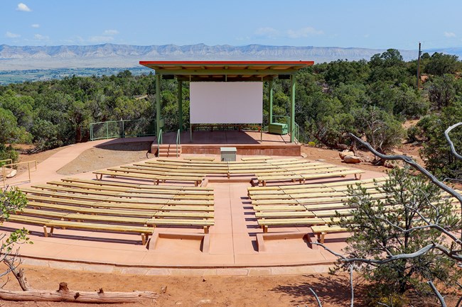 An amphitheater with wooden benches.