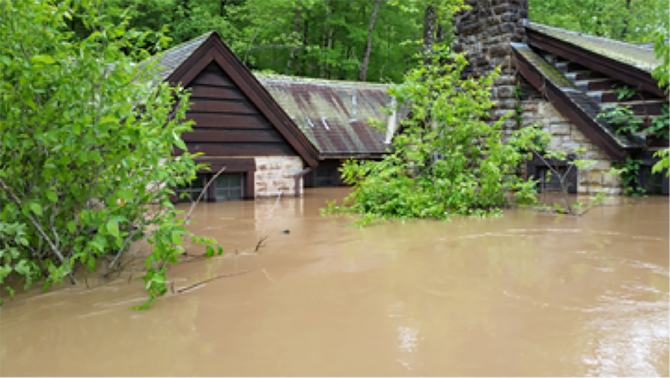 Only roof of Big Spring Lodge showing in high water