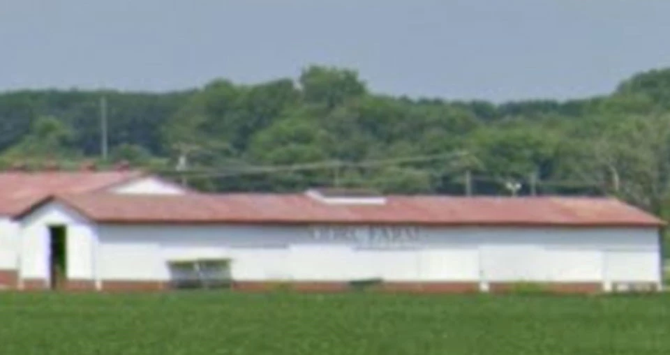 A wide wooden building with Library sign in the top middle