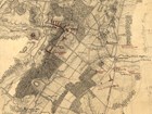 A yellowed 1800s map show terrain details with battle movements in red.