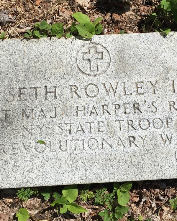 A modern tombstone with the name "Seth Rowley II" etched at the top.