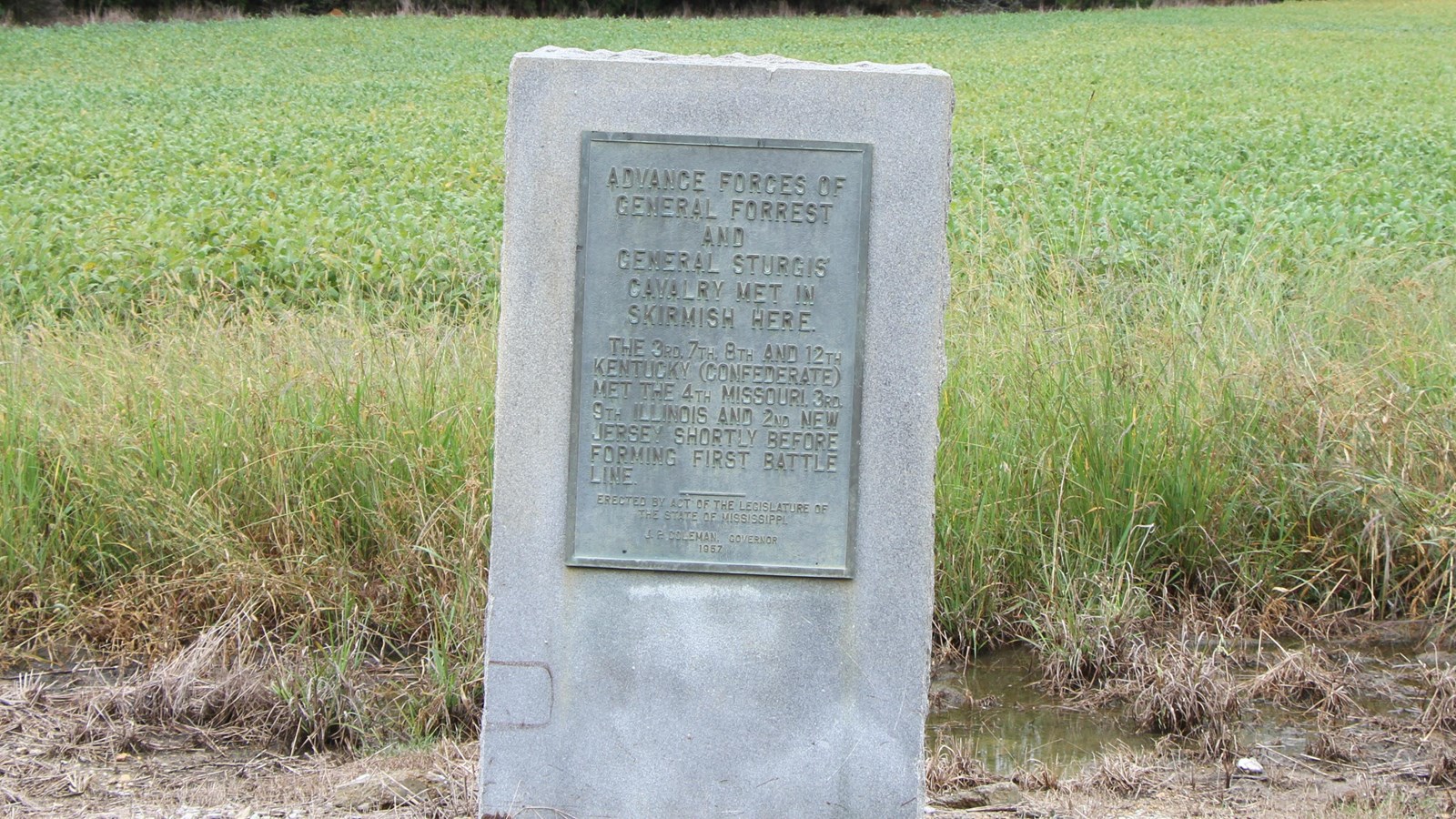 Granite marker about 4 feet tall with brass information panel on front. This is 2nd stop on tour