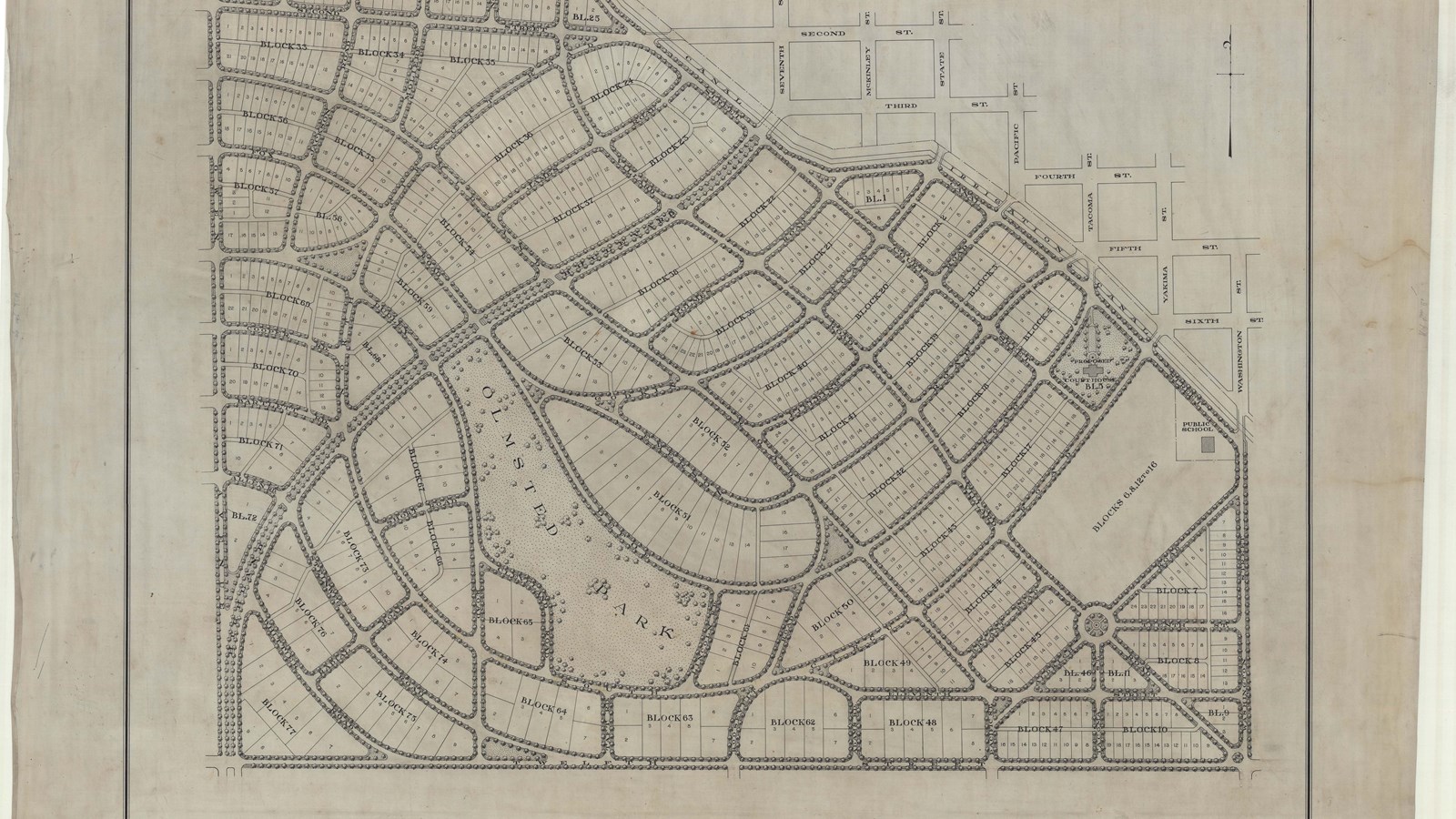Plan of suburban community with tree lined curving roads and lots of lots for homes