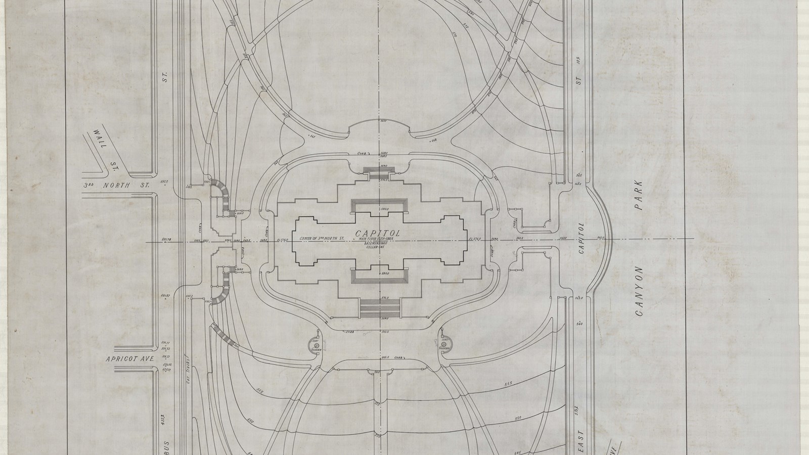 Plan of capitol building in between square made by streets with curving paths and topographical line