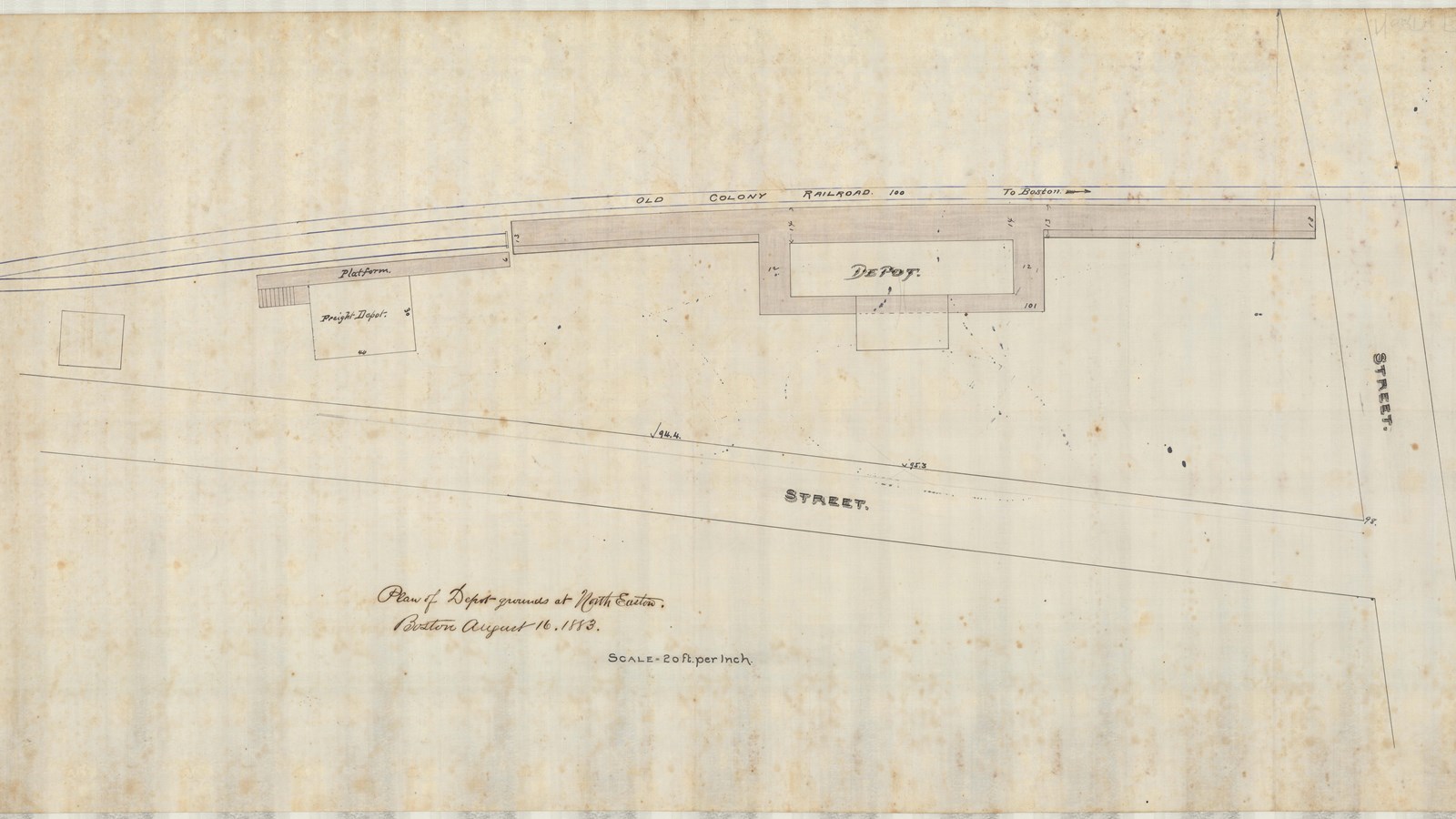 Pencil plan of two roads intersecting with buildings at intersection along a railroad