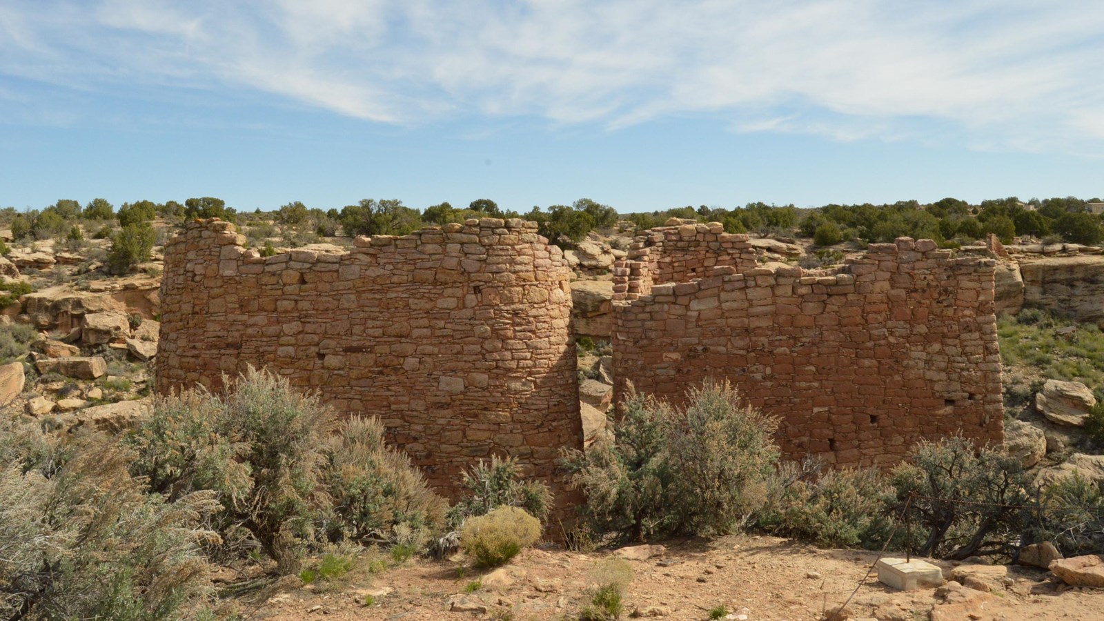 two oval stone towers built on a canyon rim