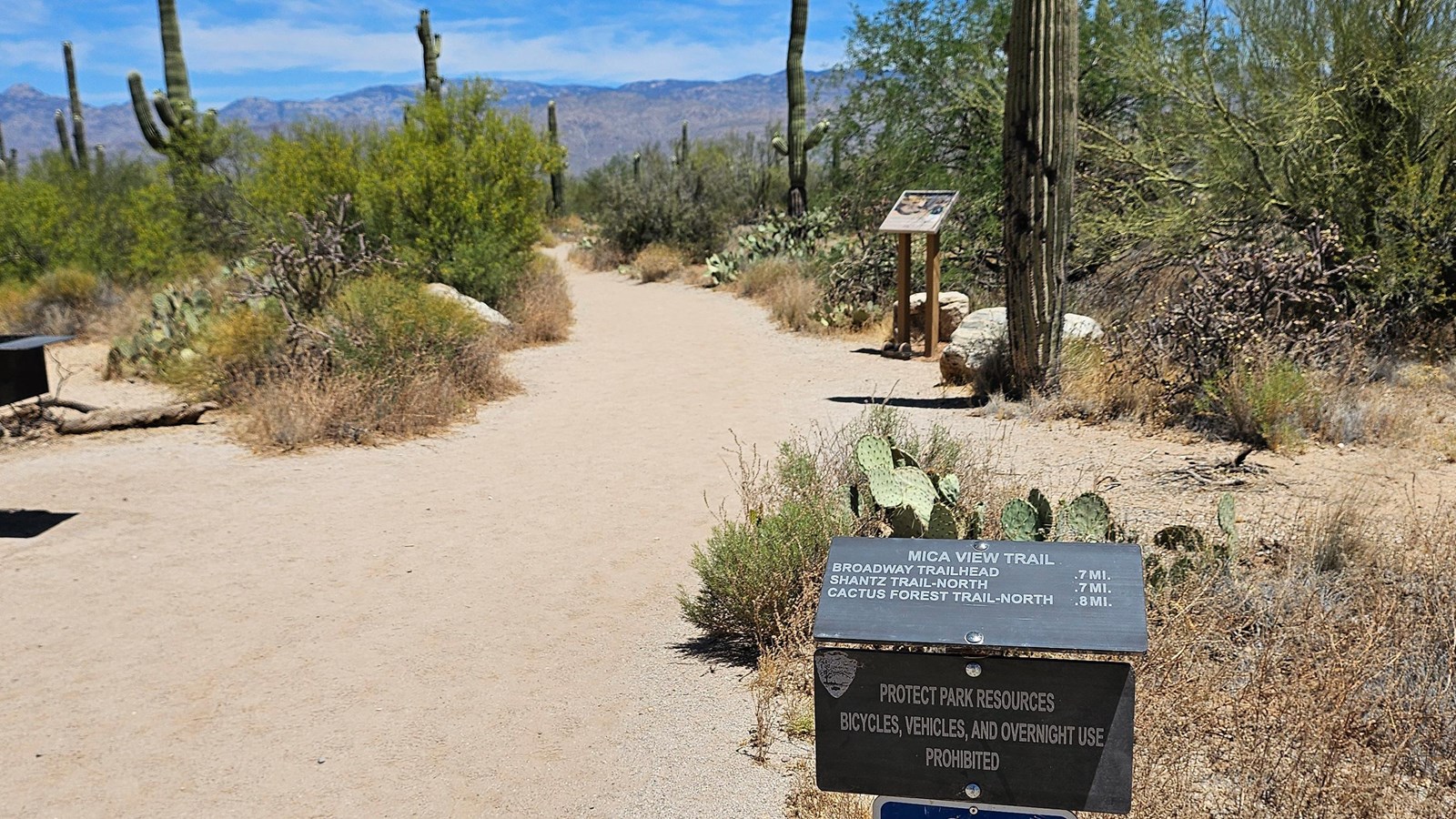 A small metal sign in the lower right reads