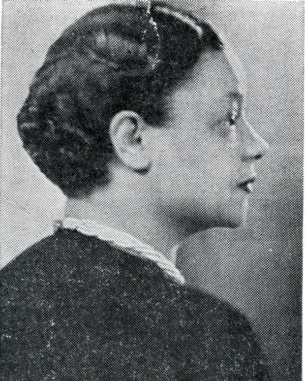 Black and white side profile picture of African American women. She is looking to the right.