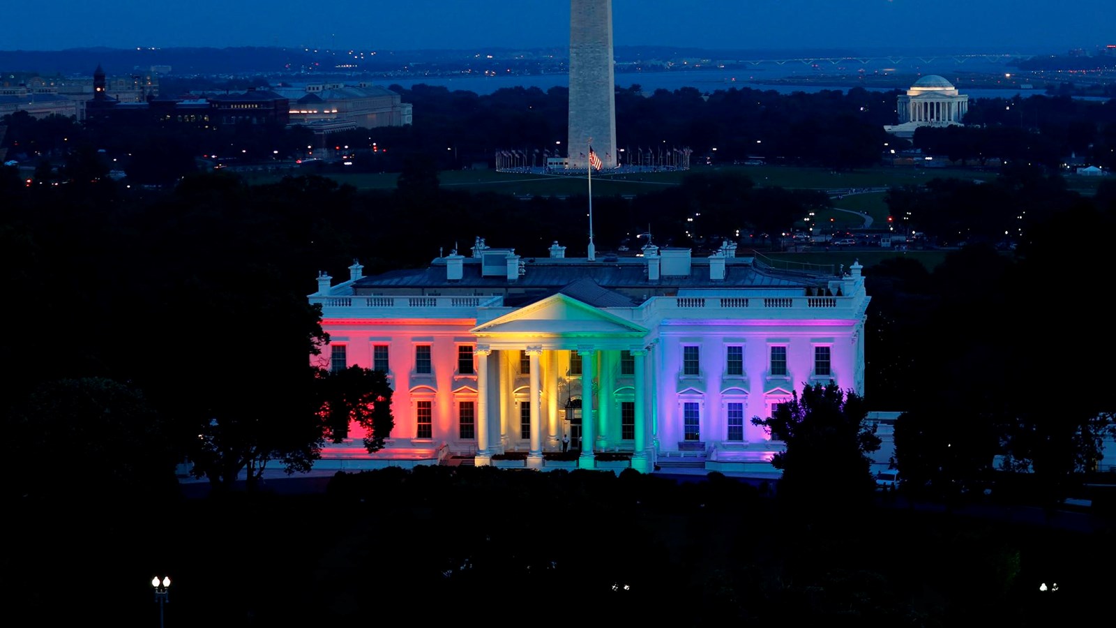 The White House is lit with the colors of the rainbow in celebration of the Supreme Court ruling.