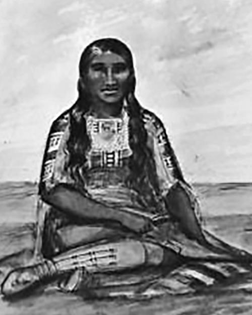 Native American woman sitting with her legs crossed to one side