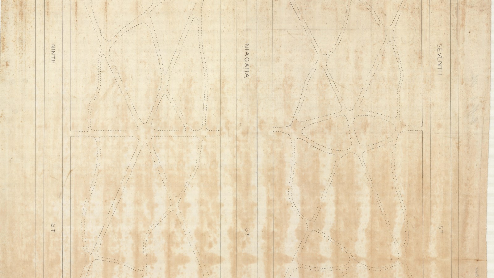 Pencil plan of two rectangular parks separated by street with curving paths through them