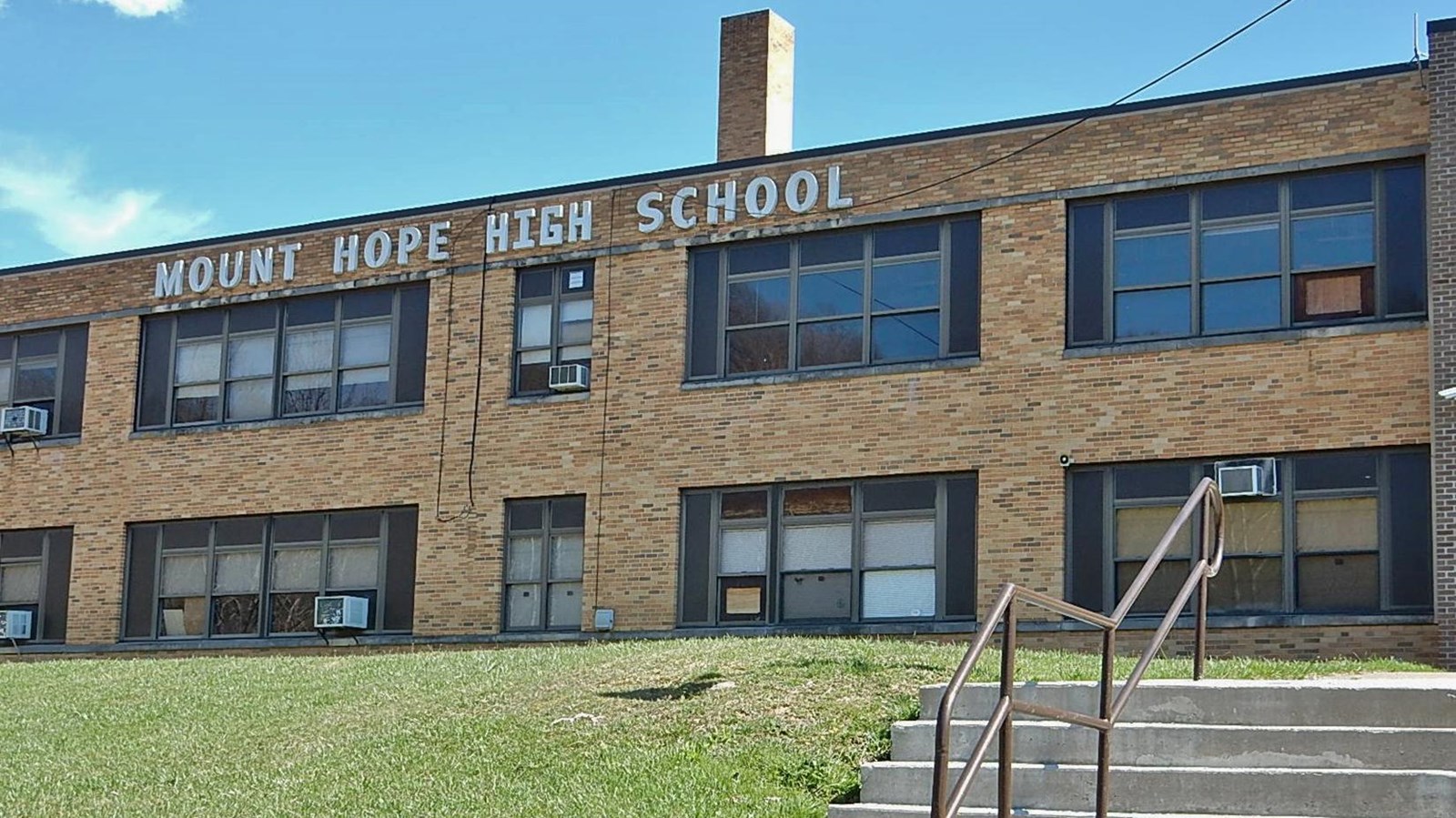 A small set of steps leading up to a school