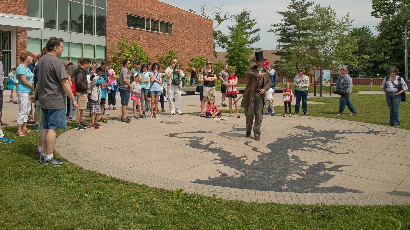 A ranger giving a program on the Chesapeake map on a sunny day.