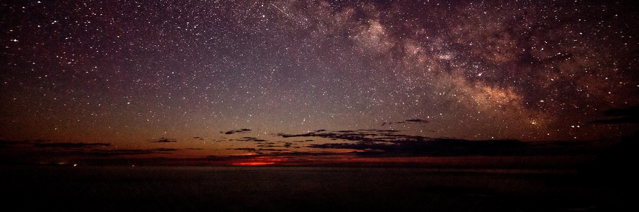 Moon-rise and Milky Way from Ocean Path