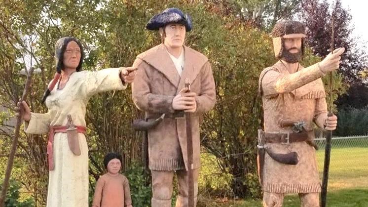 Life-size, painted statues of William Clark, Sacagawea, Jean-Baptiste, and a hunting member of the