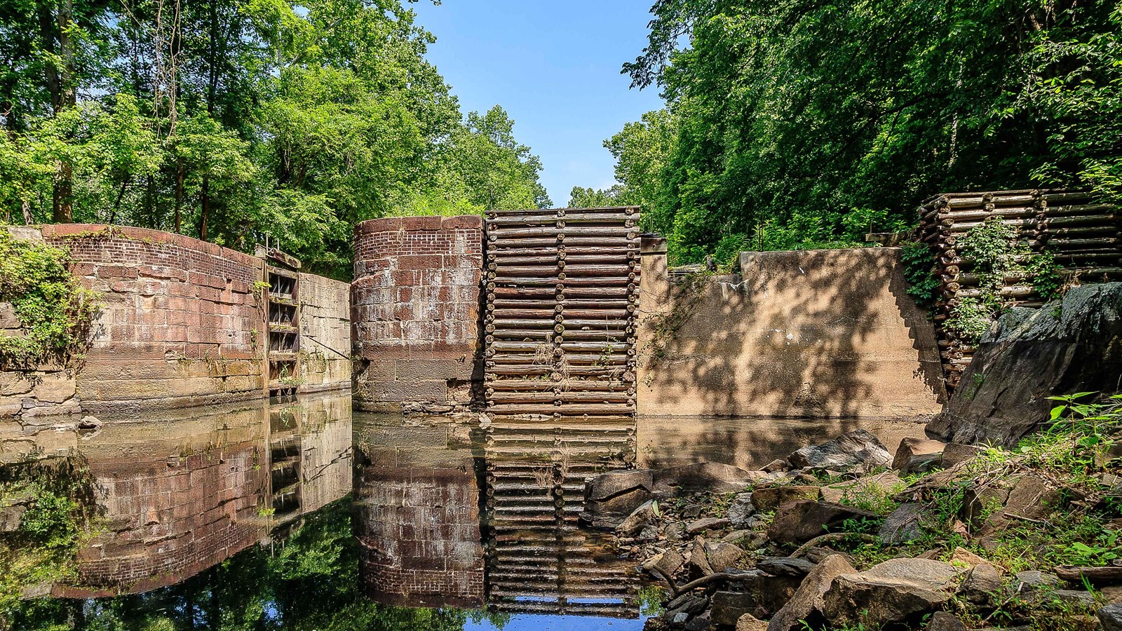 Water gathers at the base of the large lock doors. 