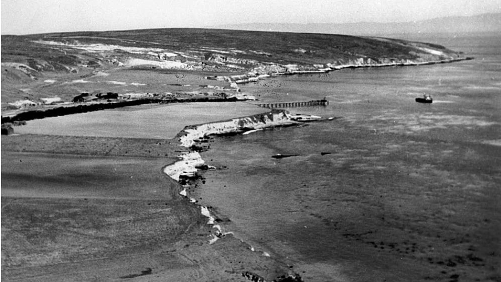 Coastline with terrace that has been farmed for hay. 