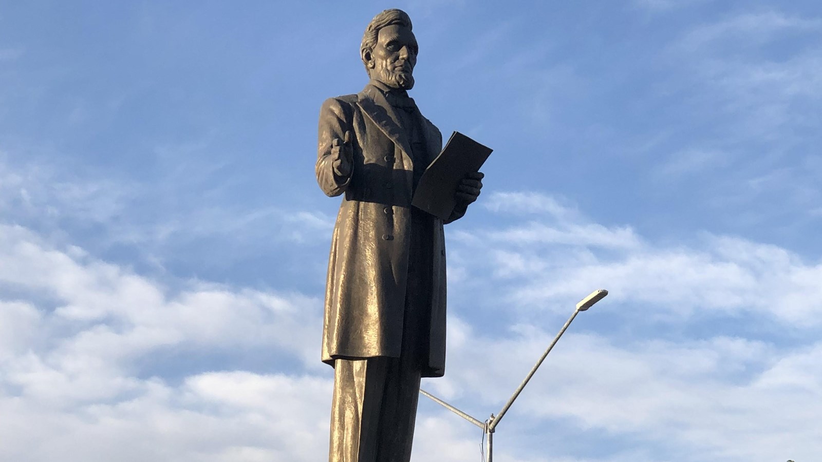 A 13-foot figure of Abraham Lincoln stands on a 10-foot pedestal.