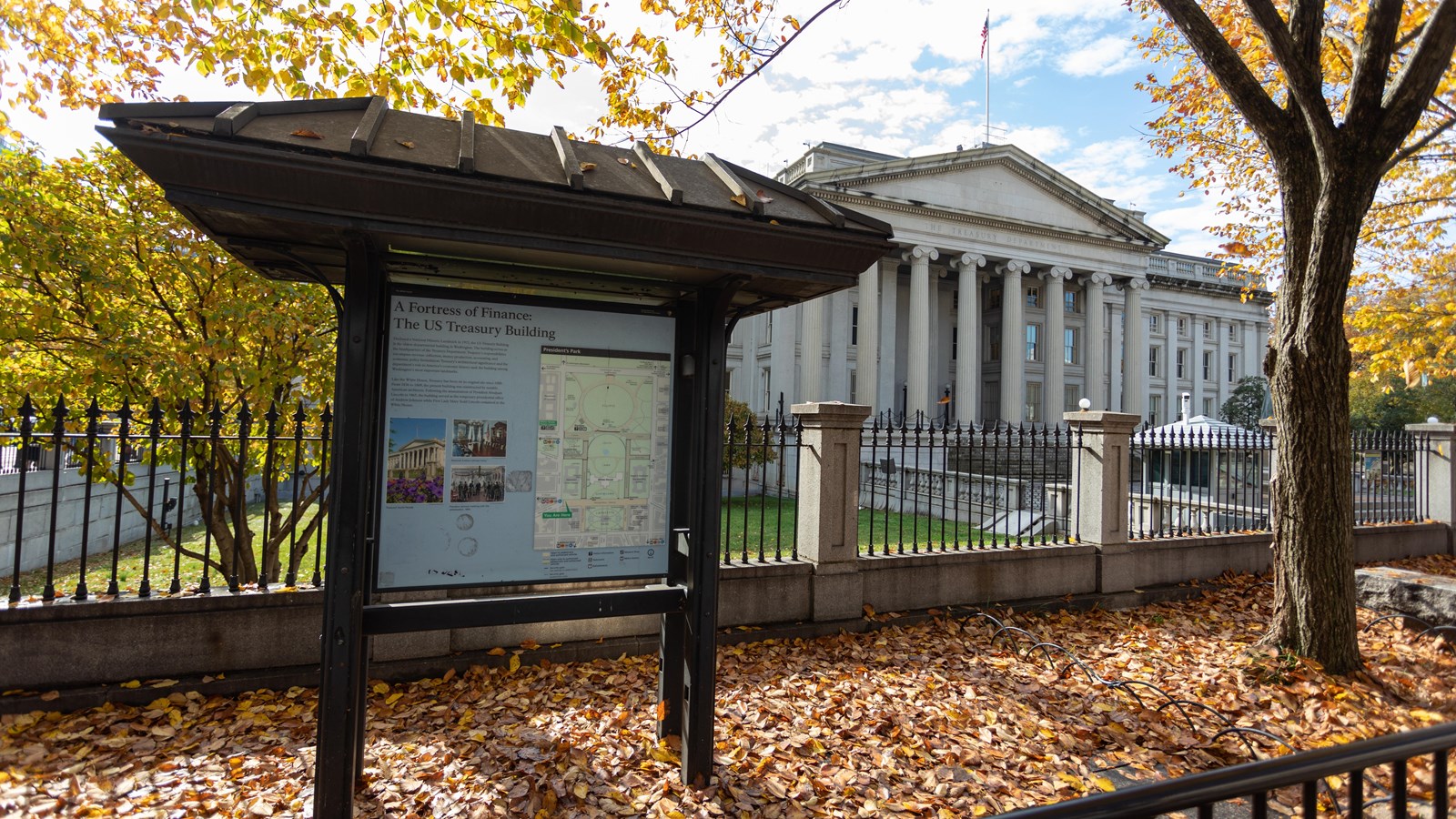 An exhibit panel describes the Treasury Building,