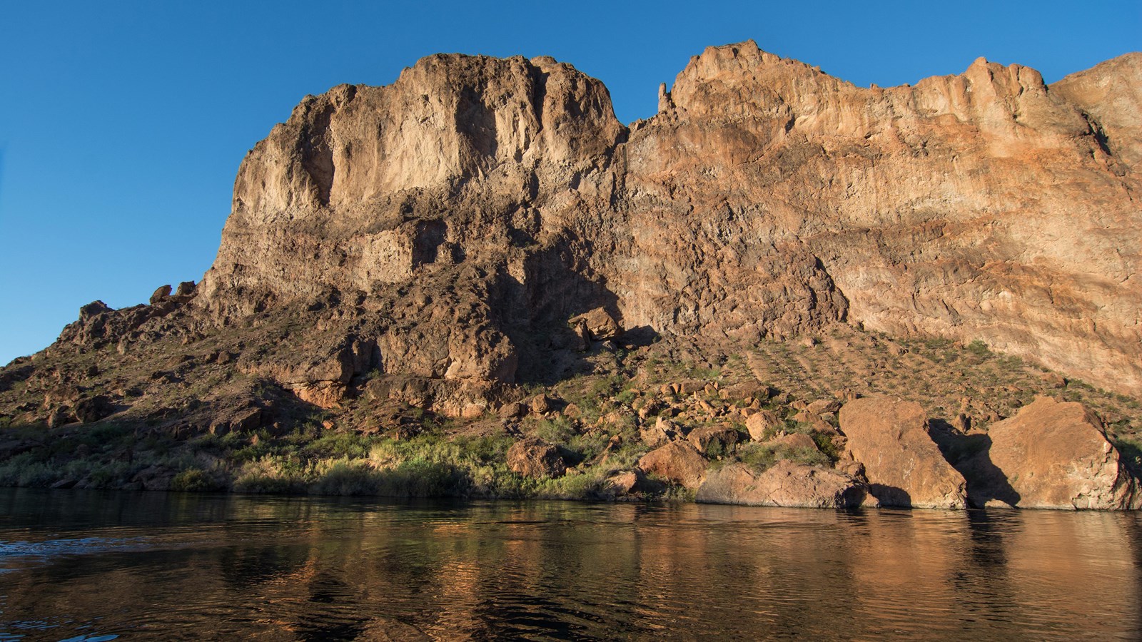 A river bends below a mountain.