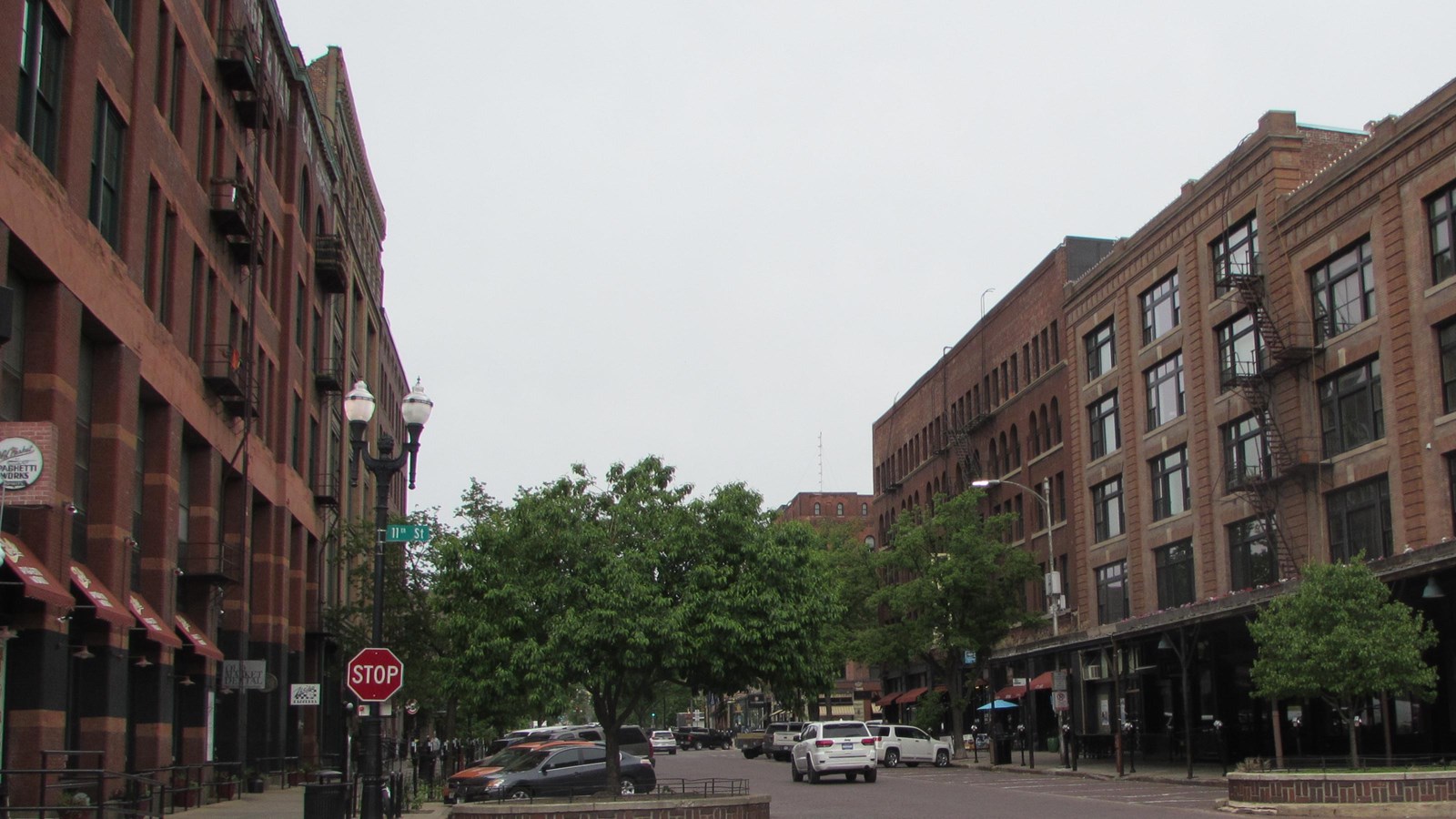 View of historic warehouse buildings and brick streets in the Old Market Historic District.