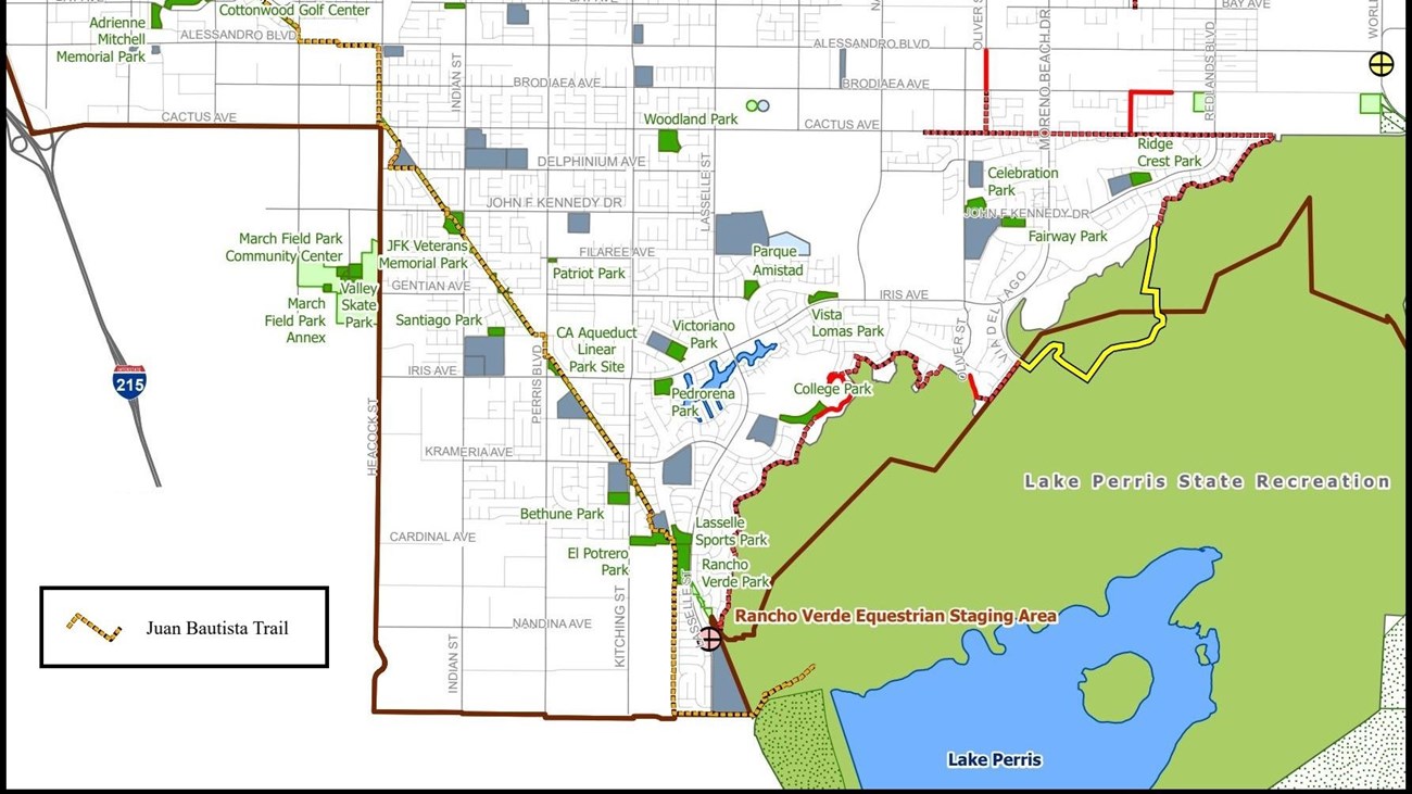 an urban trail starts at a large recreation area with a lake and moves northwest to a park