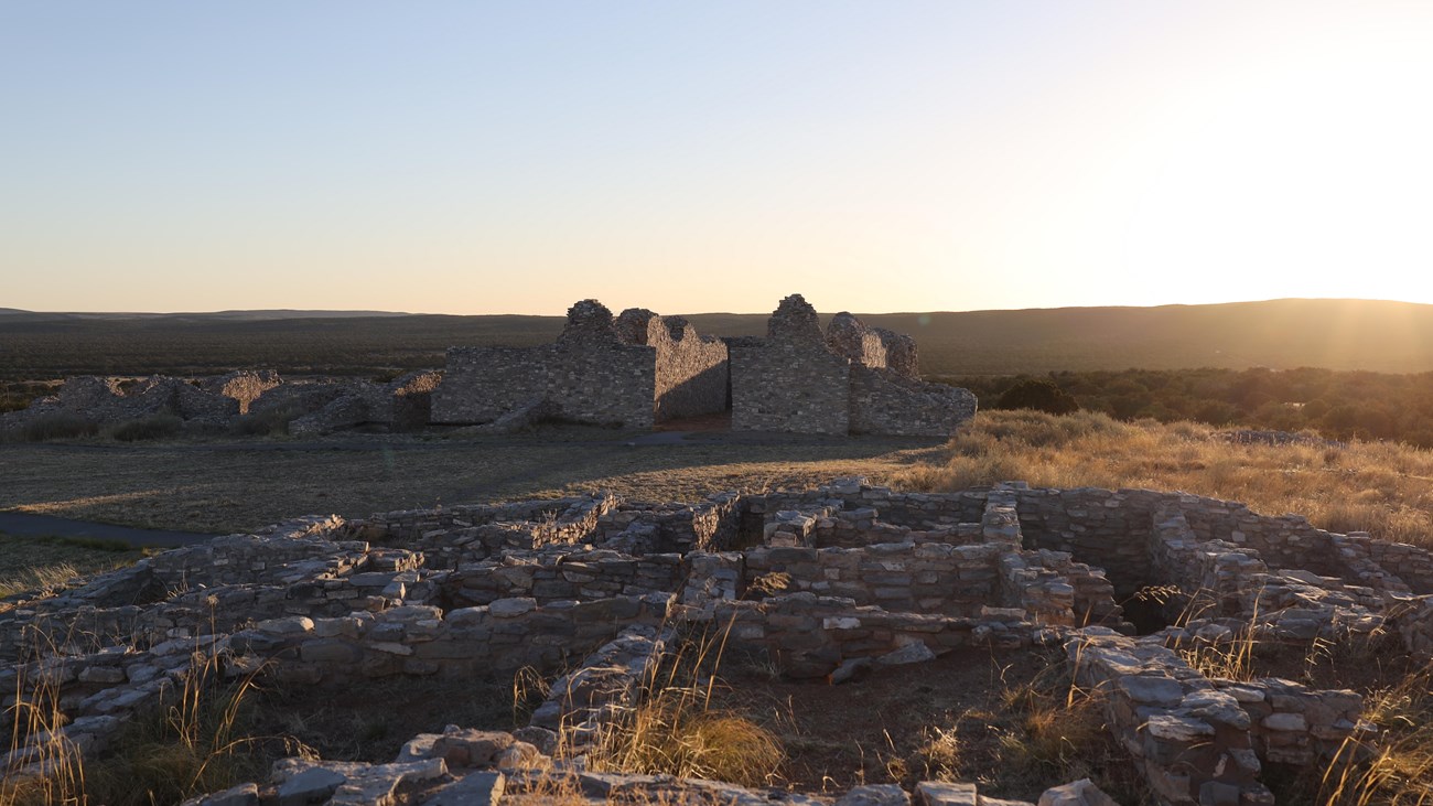 Grey limestone church and pueblo ruins