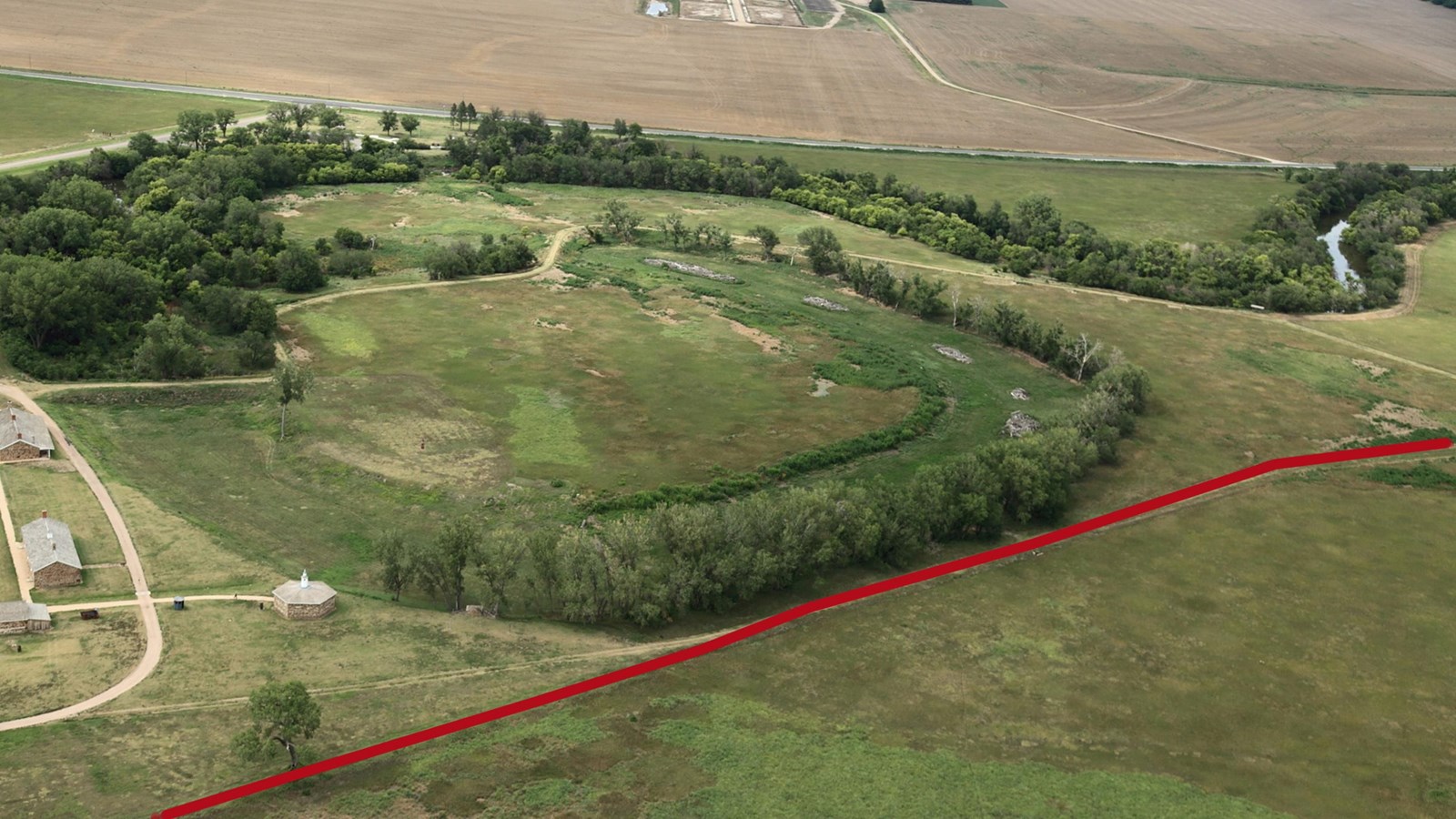 Aerial view of the oxbow with a red line indicating where the Santa Fe Trail ran by Fort Larned.