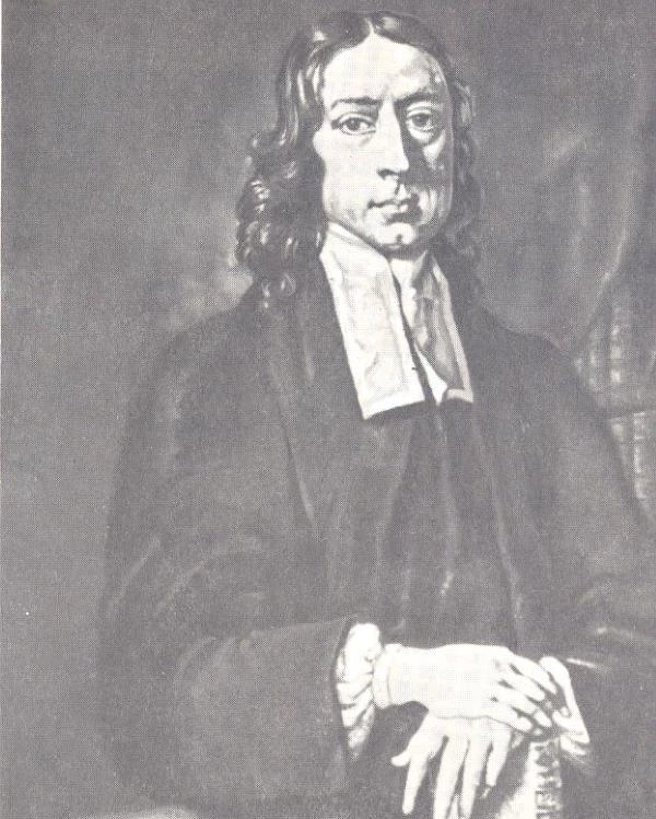 Portrait of a man with long hair and a clerical collar.