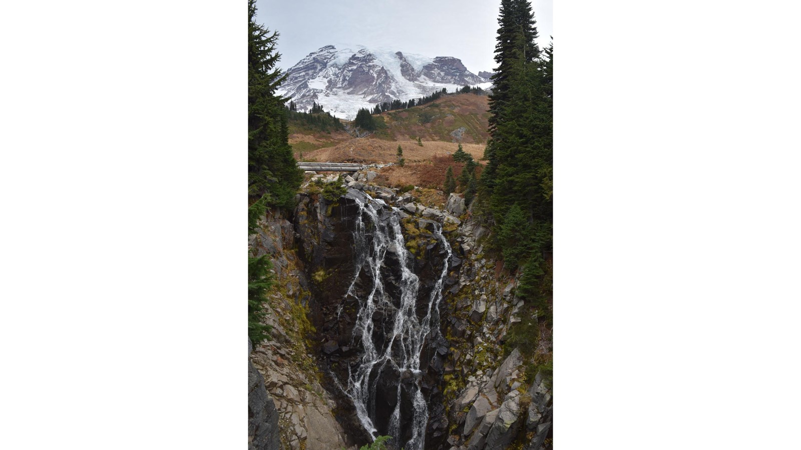 Braided cascade with glaciated mountain behind it