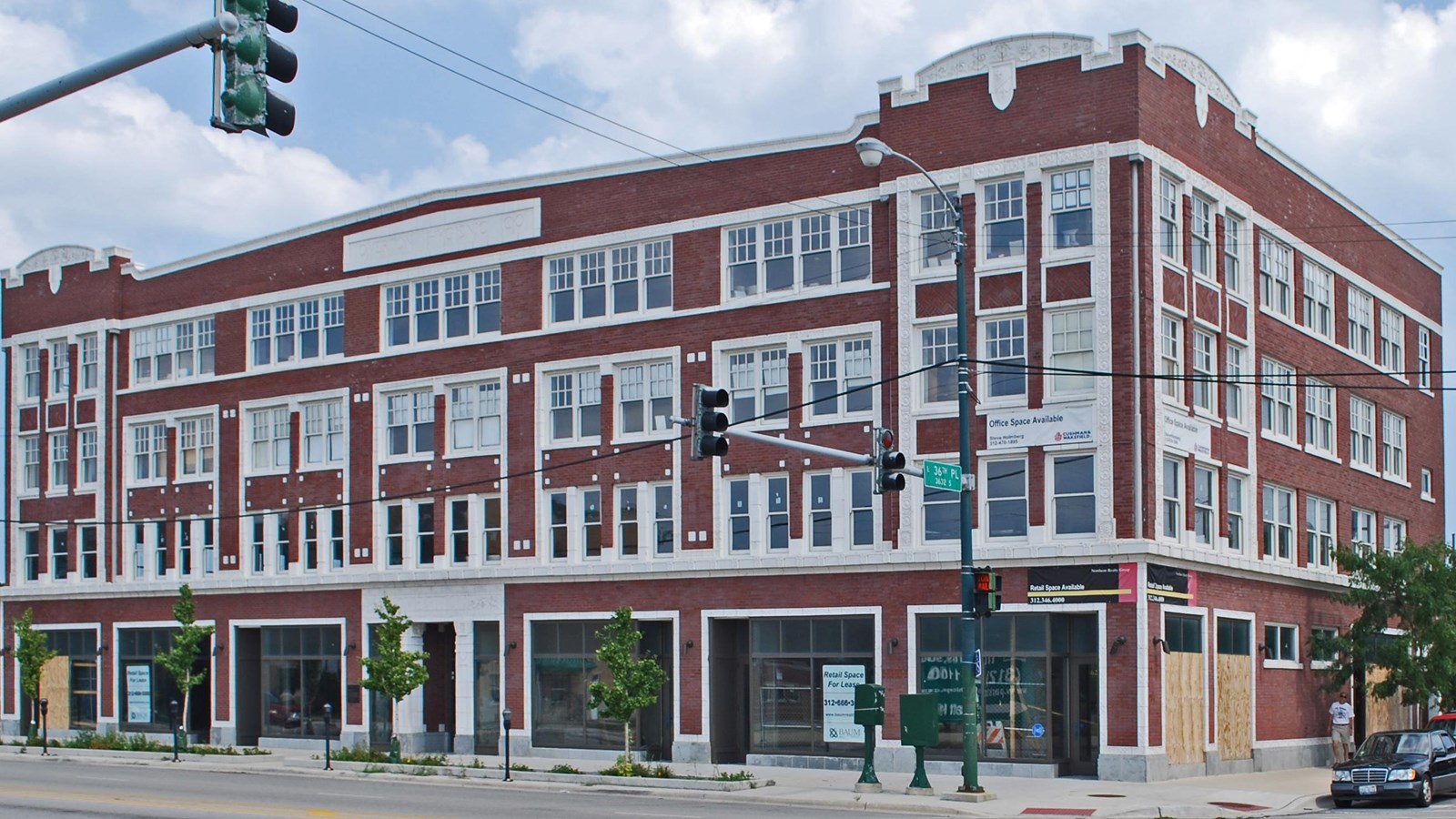 Four story brick industrial building.