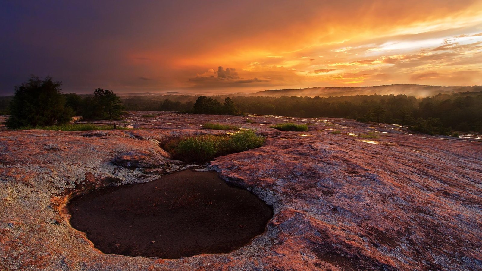 A sunset at the summit of Arabia Mountain.