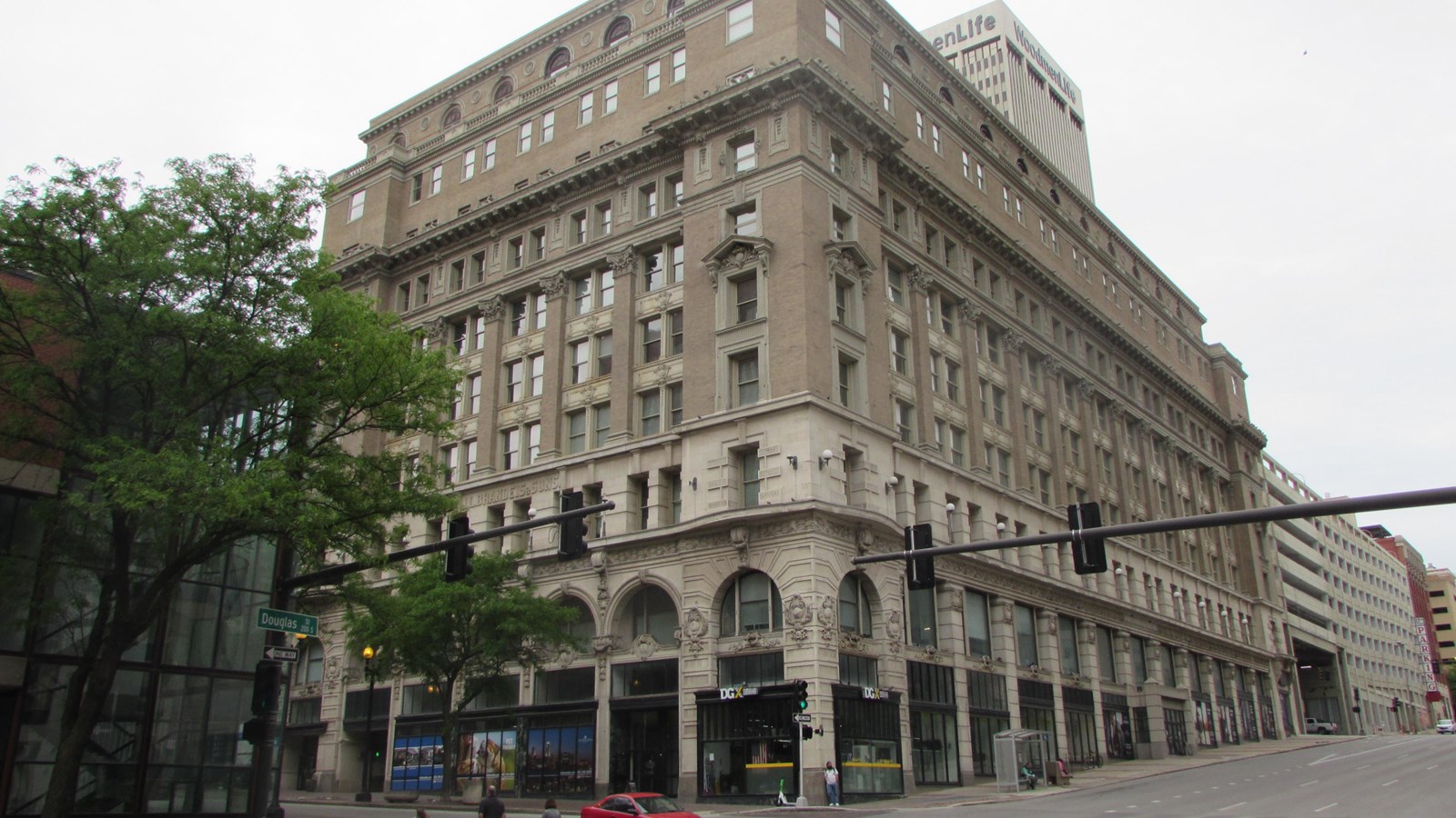 Eight story, Second Renaissance Revival building on downtown corner lot. First floor storefronts