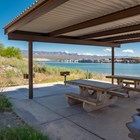 A picnic shelter next to water