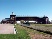 An expansive pedestrian bridge over a highway.