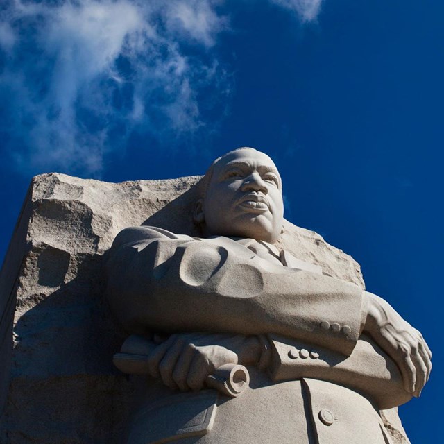 blue sky behind Martin Luther King statue