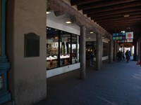 A large pink adobe building with a large front hacienda.