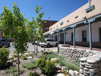 A two-story adobe building with a first floor hacienda.
