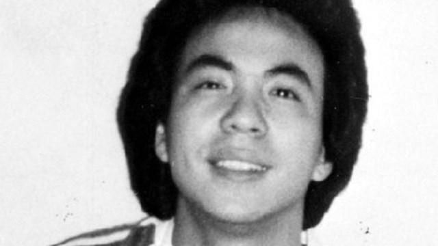 Black and white photo of Vincent Chin in a V-neck shirt looking at the camera. 