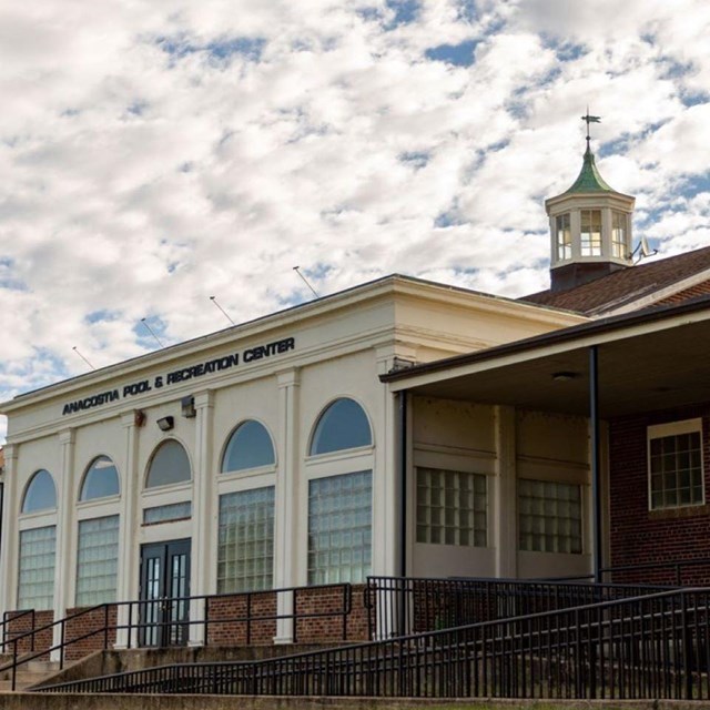 A large brick building with Anacostia Recreation Center and Pool on it.