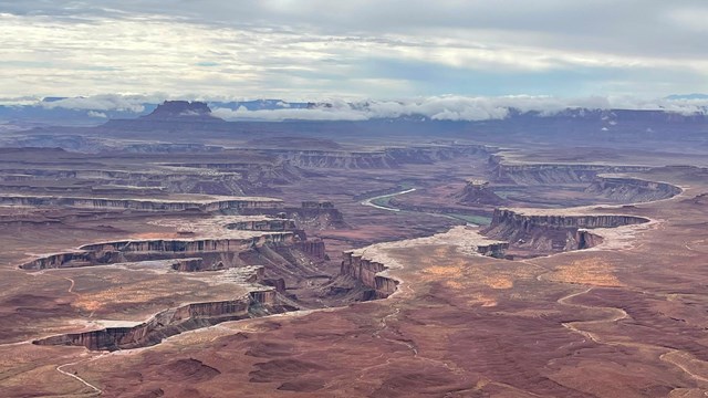 View looking down on a broad area of canyons.