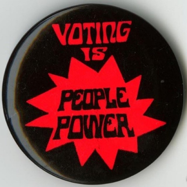 Button with text Voting is People Power