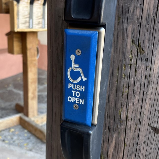 A blue button with white lettering that says, 