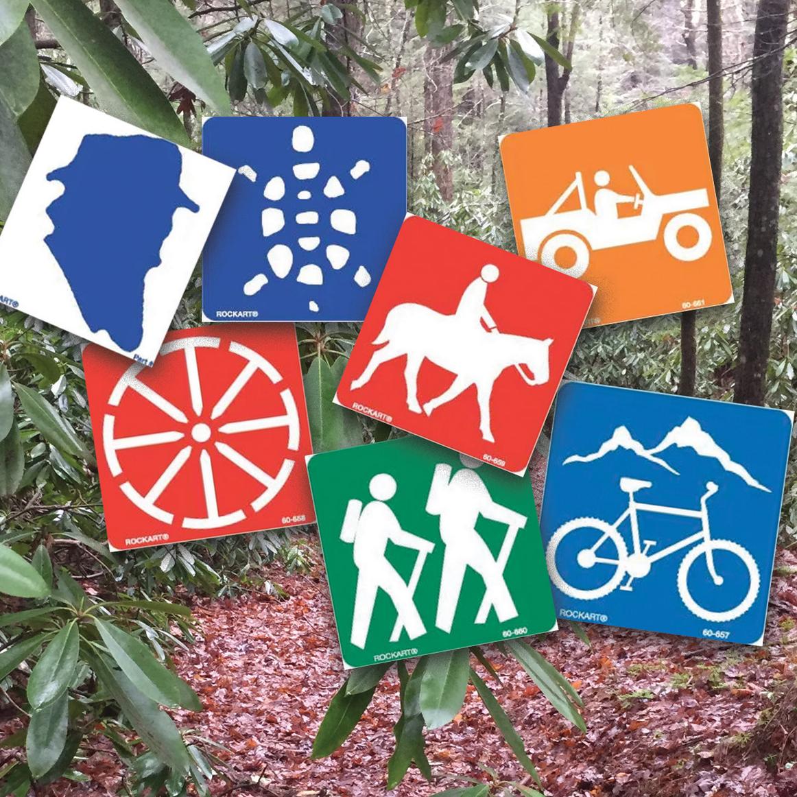 Trail wooded background with trail marking signs ontop