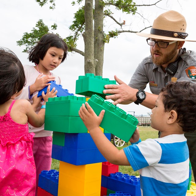 A ranger working with young visitors