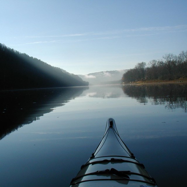 View from a kayak floating on a river. 