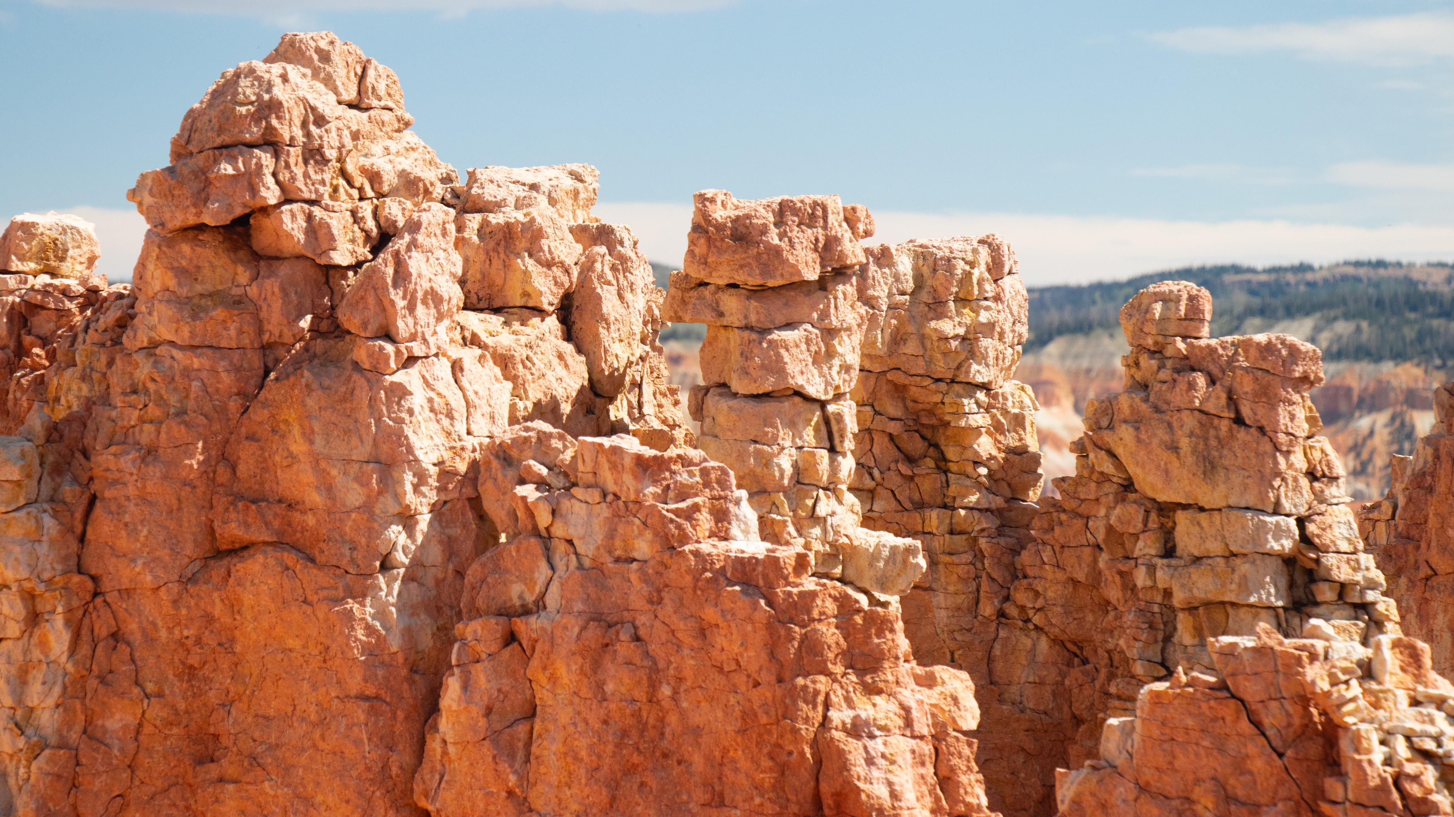 Pillars of red rock that are cracked and crumbly.