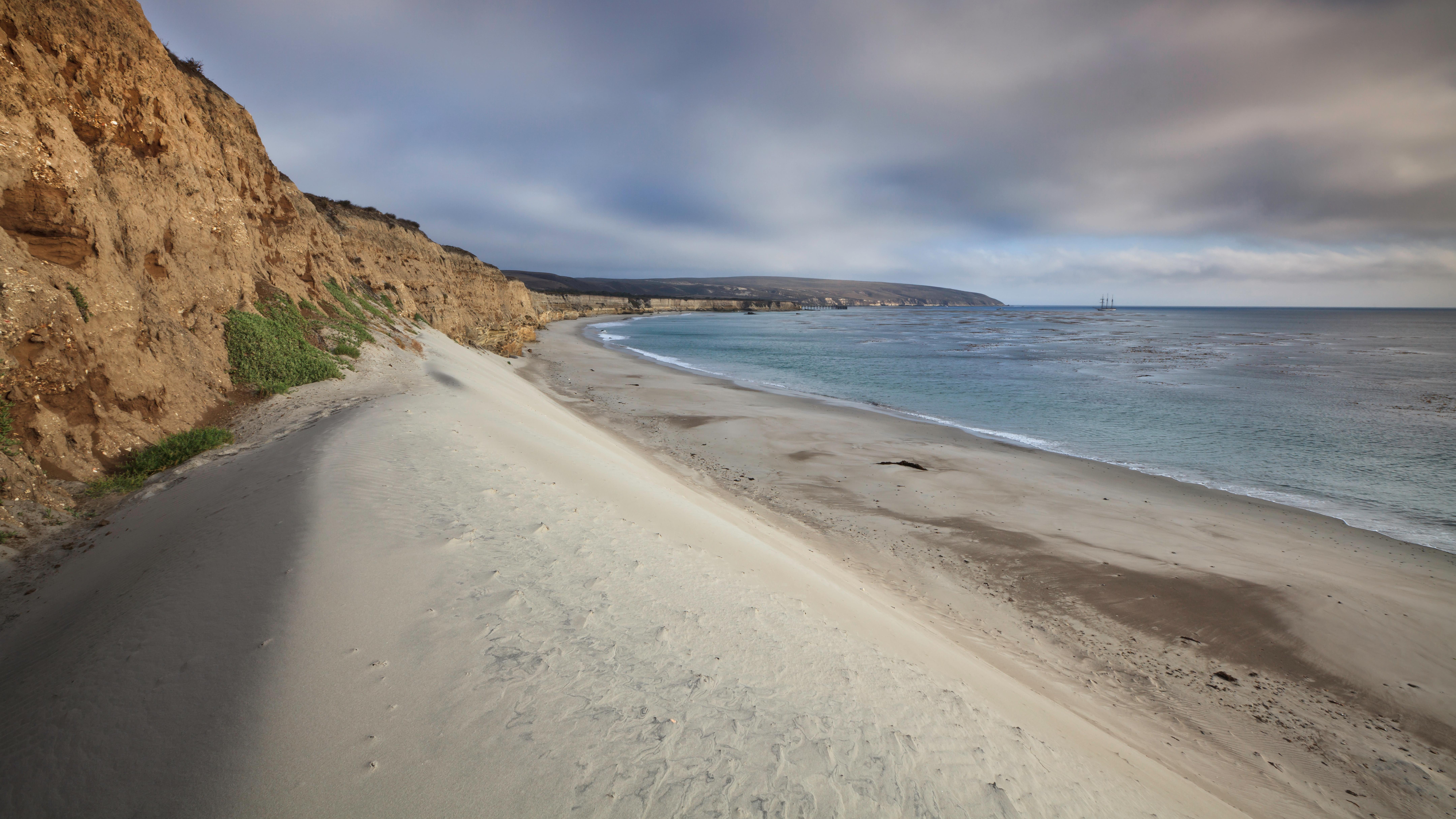 White sand dune with blue water. &copy;Tim Hauf, timhaufphotography.com
