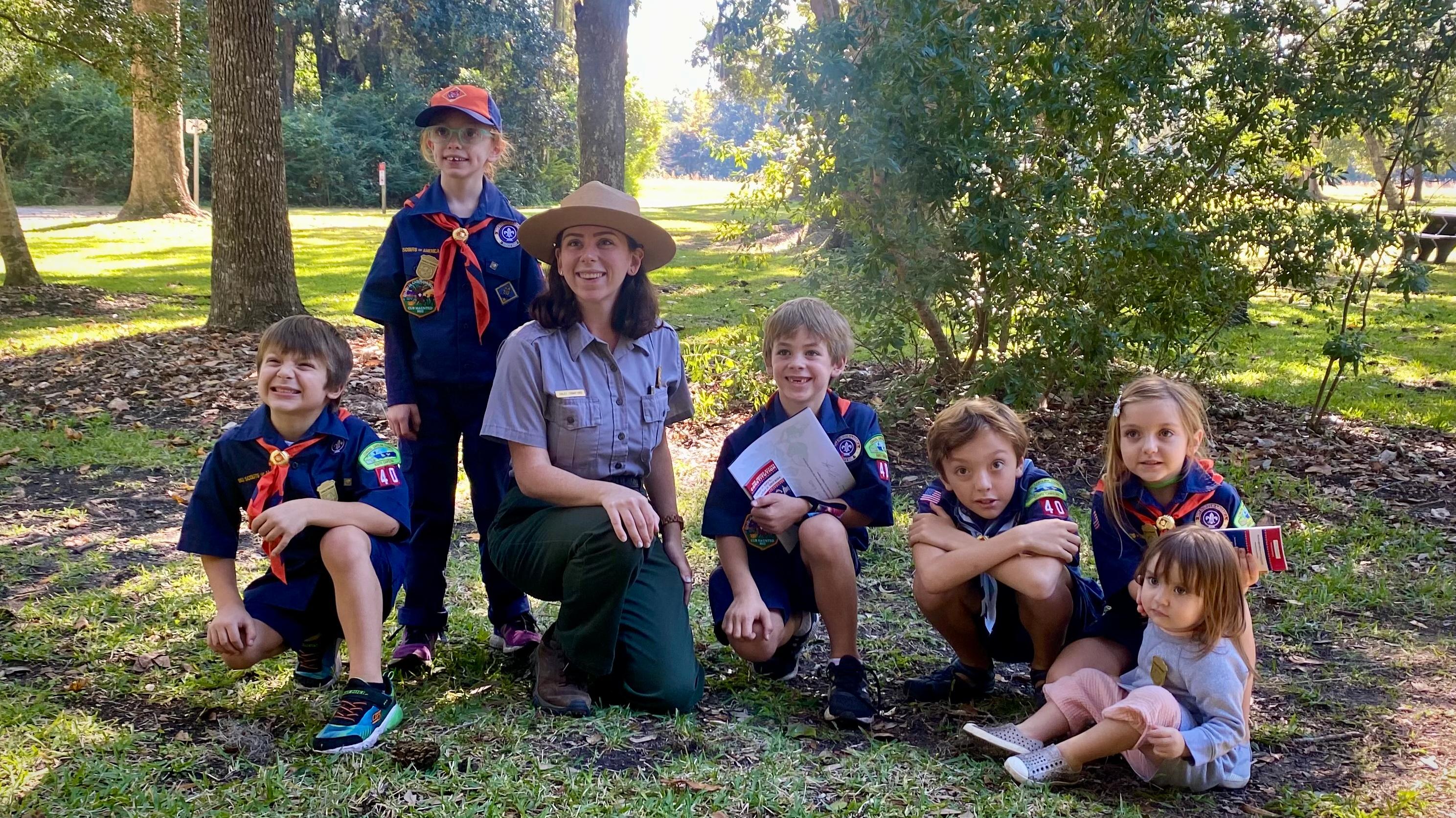 A scout troop listens to a Ranger talk about historic resources