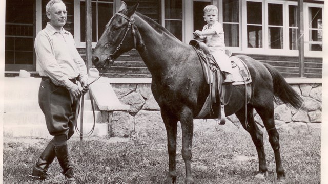 1936 photo of man and horse outside McGraw Ranch.